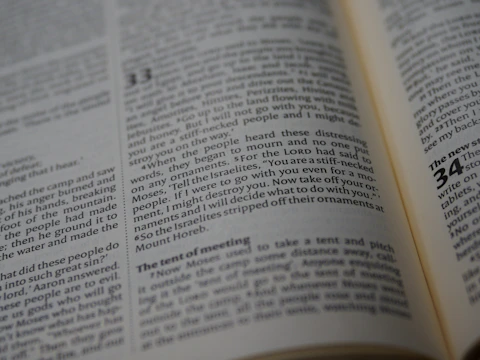 An open book with visible text, focusing on a passage that highlights a biblical story. The text is printed in columns with a header indicating a chapter number.