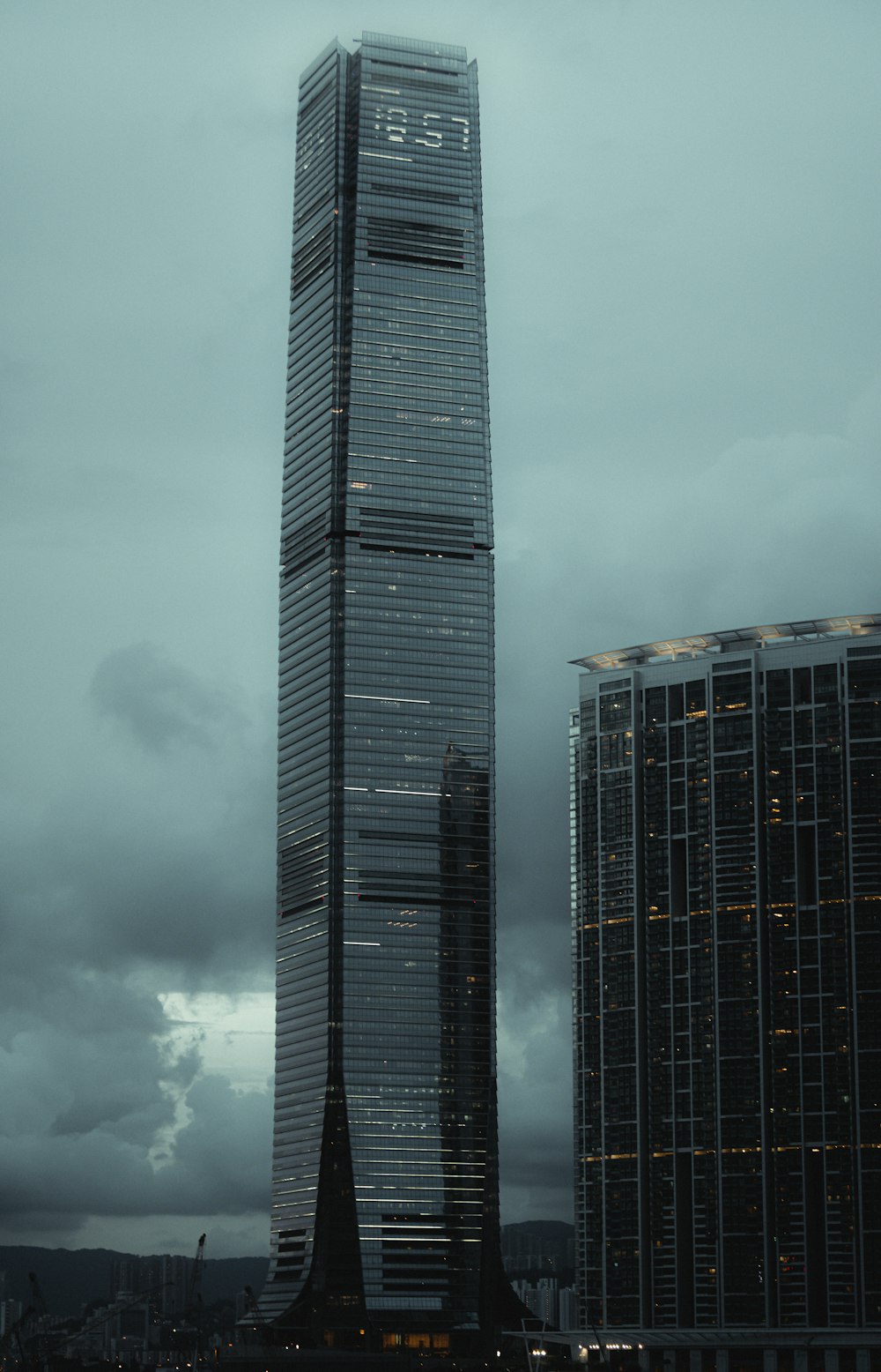 black high rise building under white clouds
