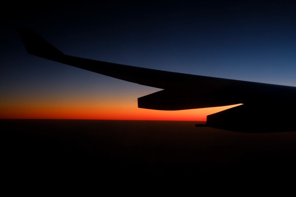 airplane wing during golden hour