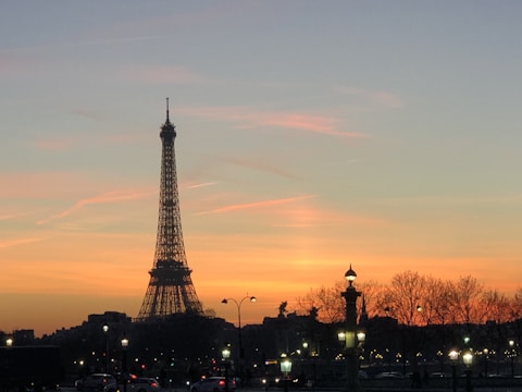 Original painting of a Paris street scene at sunset.