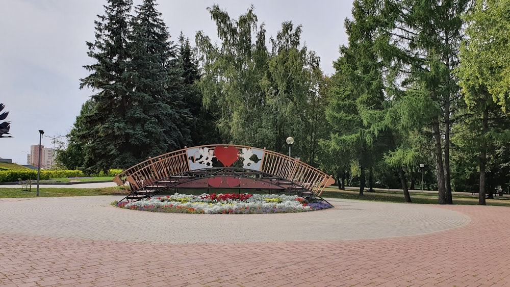 red and brown stadium surrounded by green trees during daytime