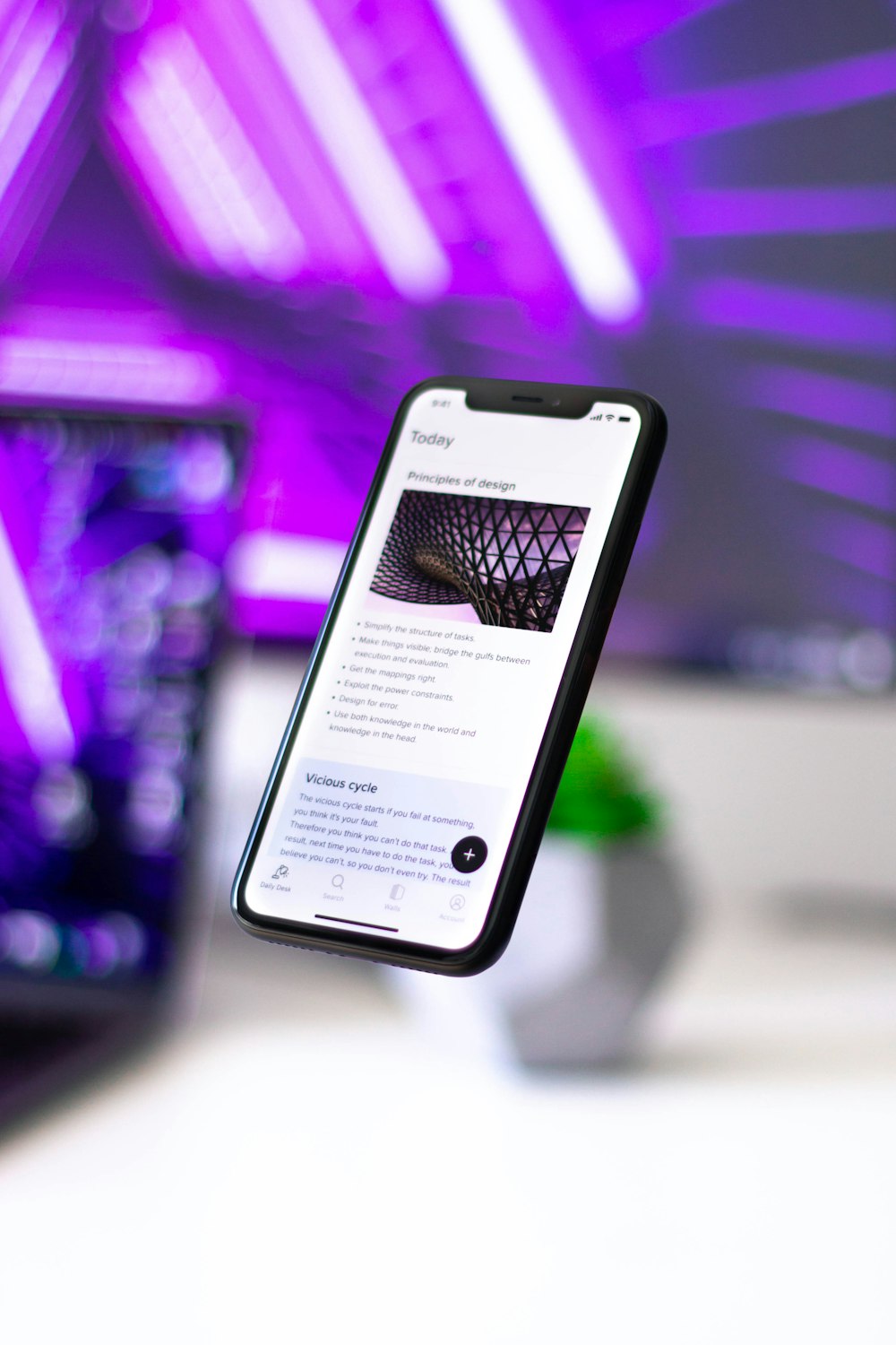 black smartphone on white table