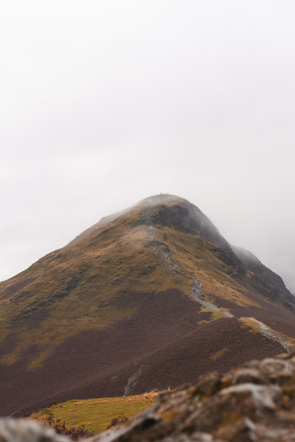 brown mountain under white sky during daytime