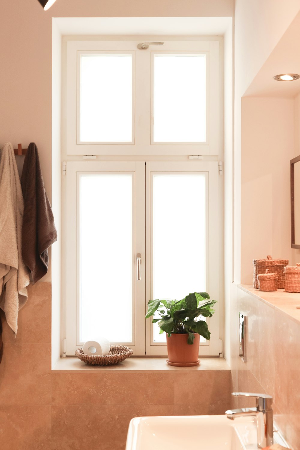 white ceramic sink near white wooden door