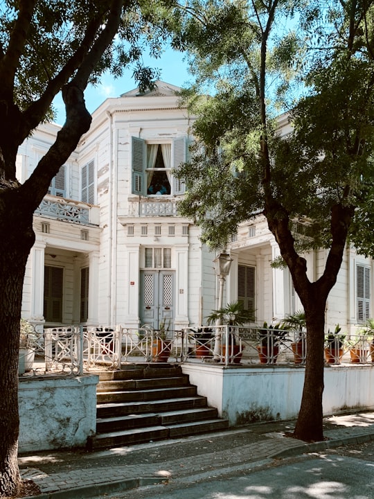 white concrete building near green trees during daytime in Büyükada Turkey