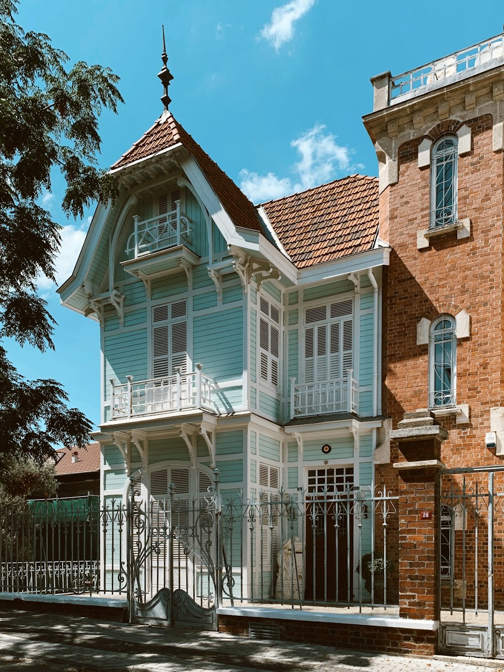 brown and white concrete house under blue sky during daytime