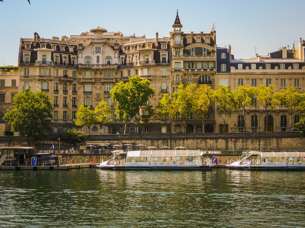 brown concrete building near body of water during daytime