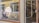 A store front with a large glass window displaying the logo and name 'HETKI design' in white lettering. Inside the store, various clothing items are visible on racks and shelves. The exterior features a yellow wooden building with white trim and some reflective surfaces.