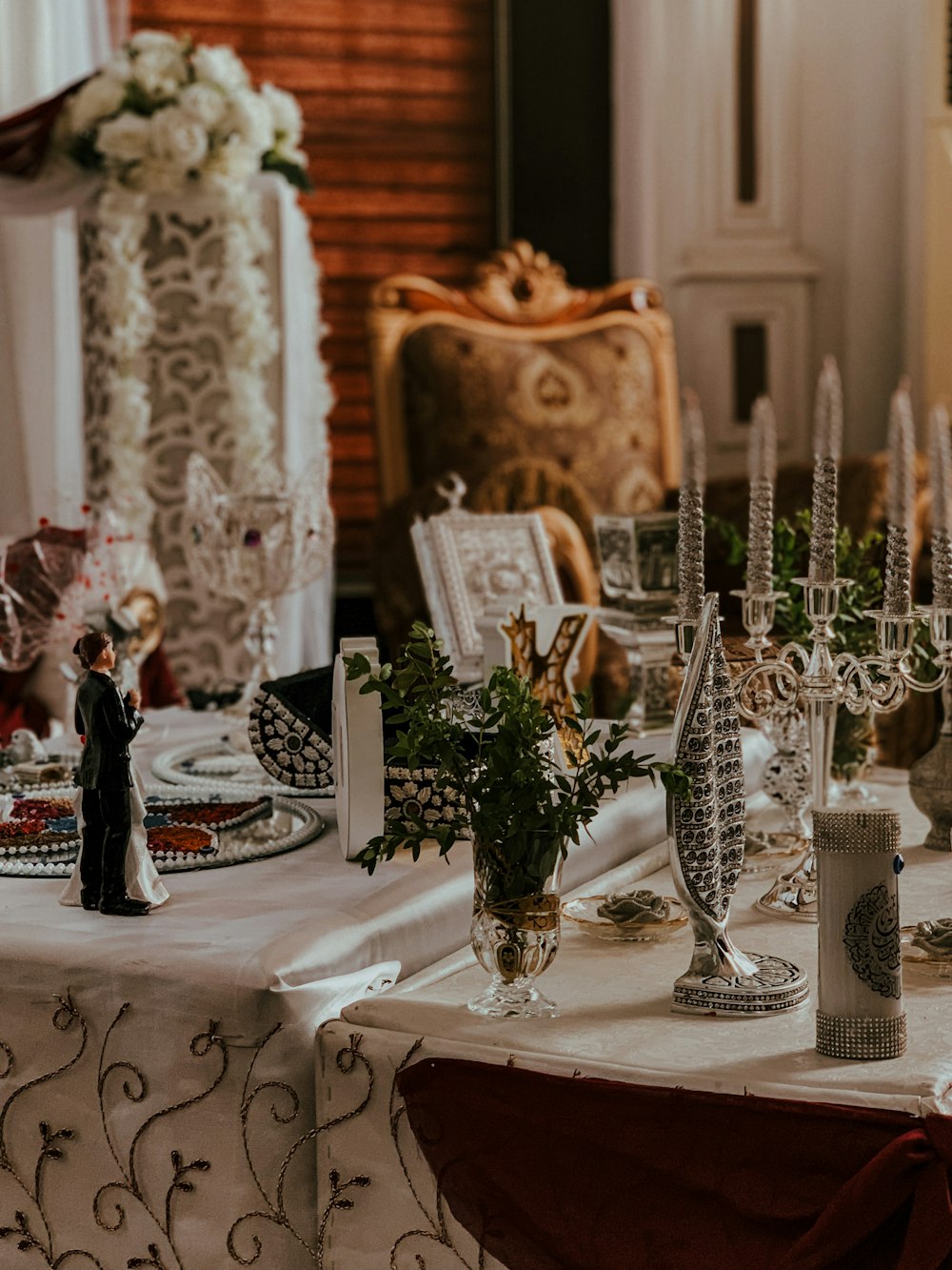 white and black ceramic figurine on white table