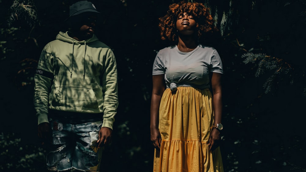 man in white crew neck t-shirt and woman in yellow dress