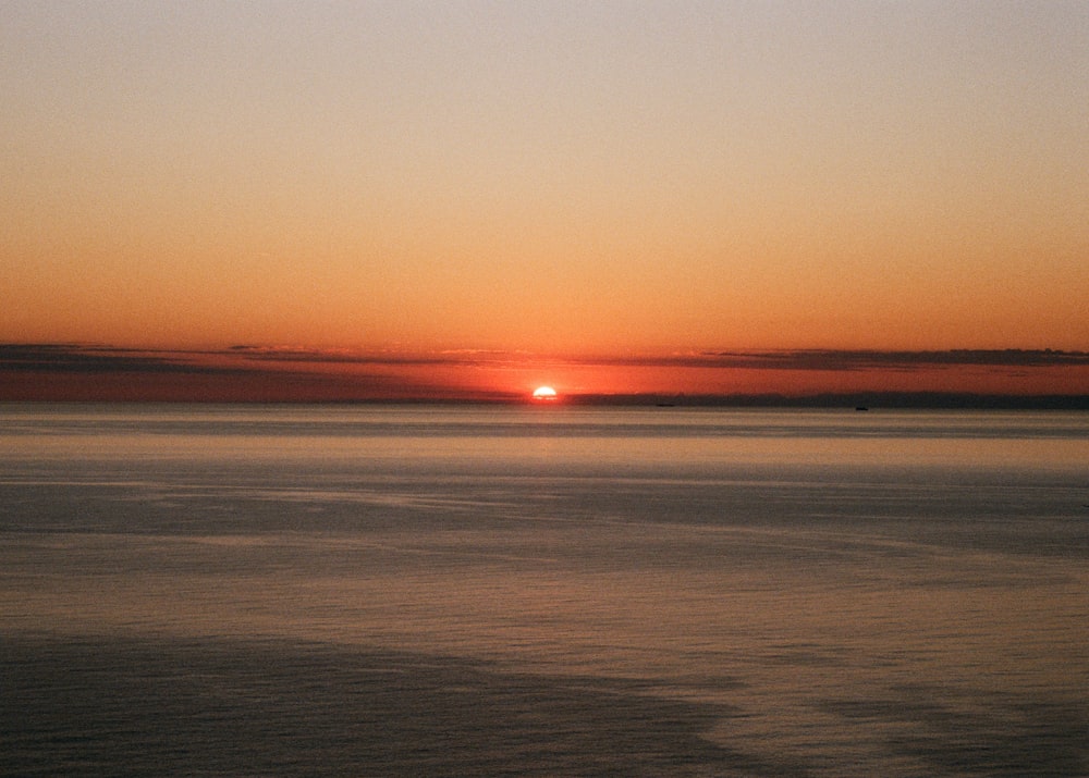 body of water during sunset