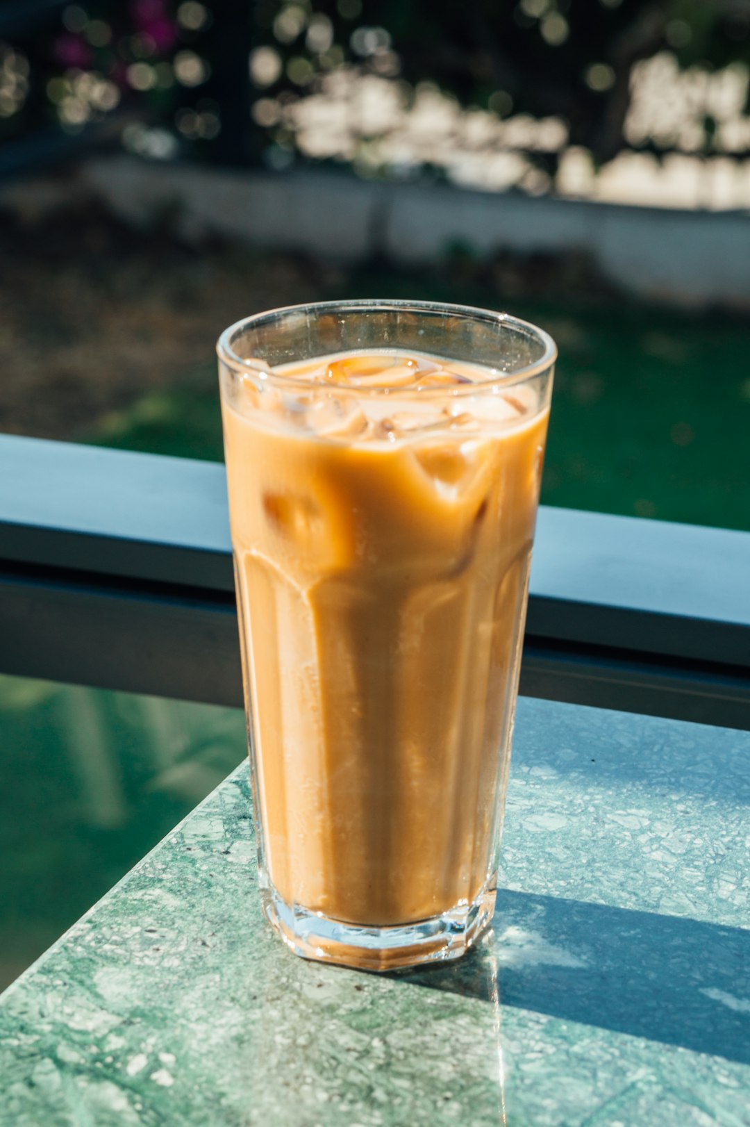 clear drinking glass with brown liquid