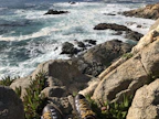 Close-up of sturdy hiking boots on rocky terrain