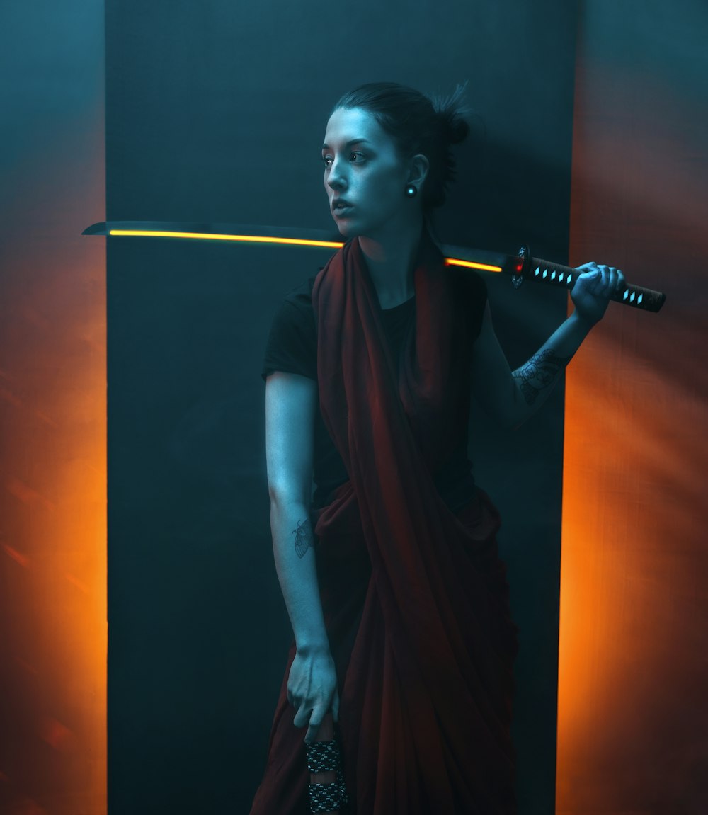 woman in black sleeveless dress holding microphone