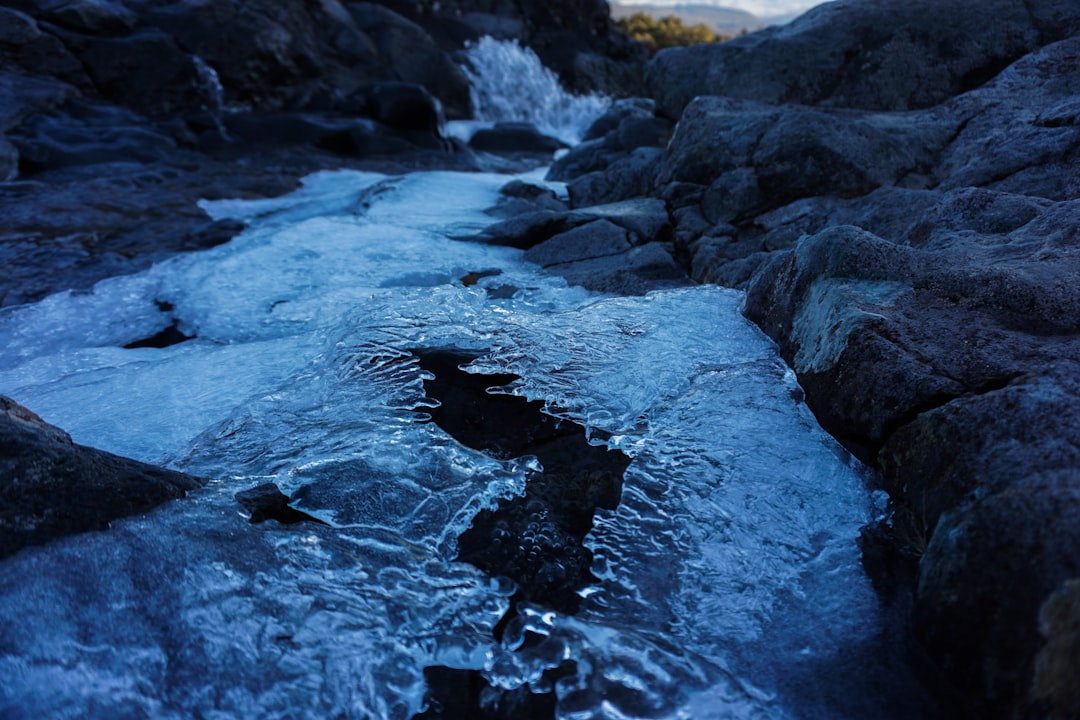 water waves on rocky shore during daytime