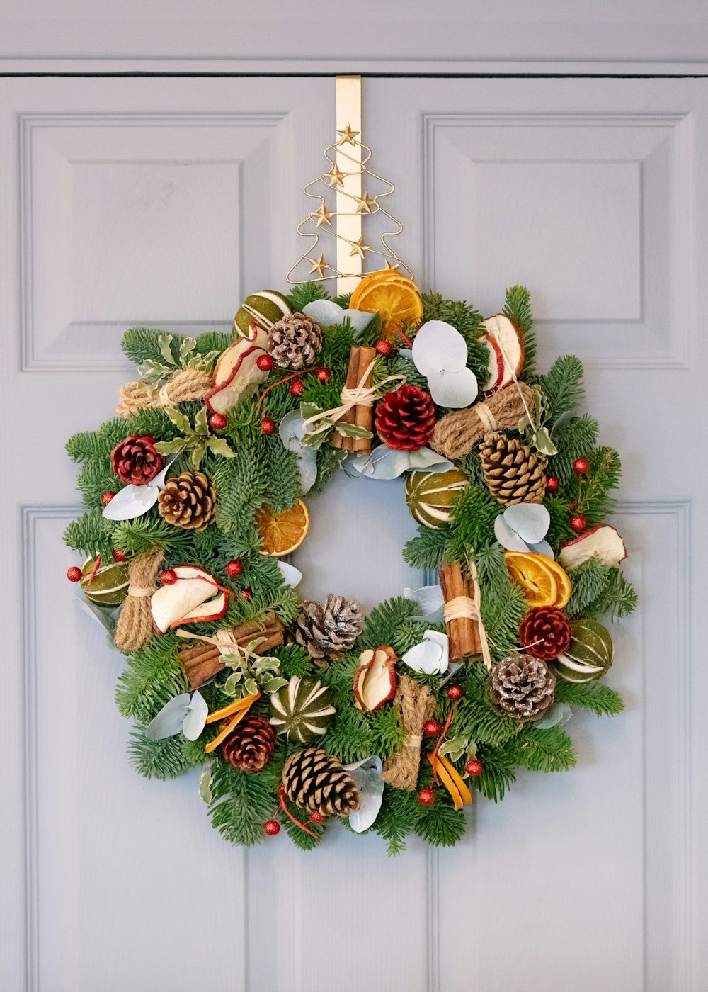 green and brown pine cone wreath