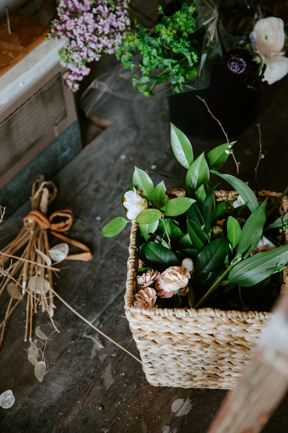 brown woven basket with green plant