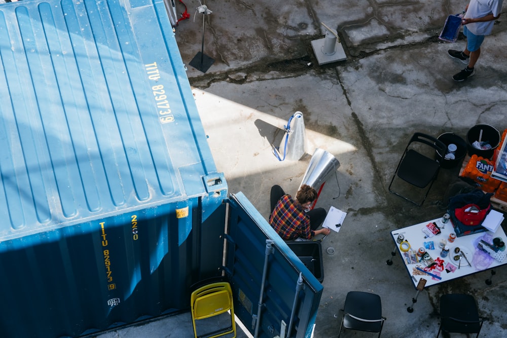 blue plastic crate beside white plastic container