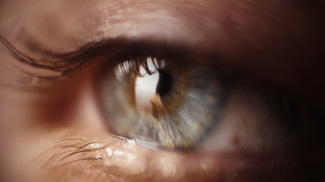 persons eye in close up photography