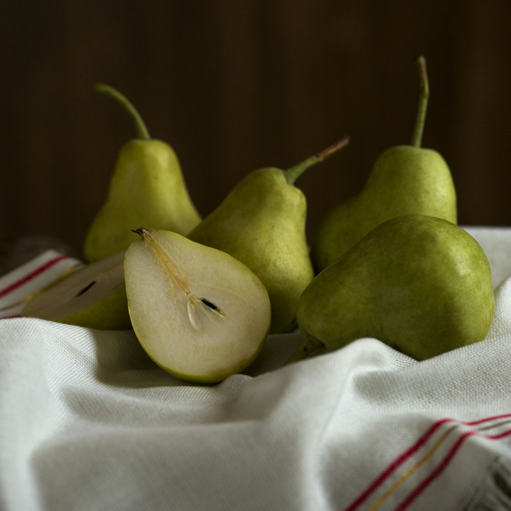 green apple fruit on white textile