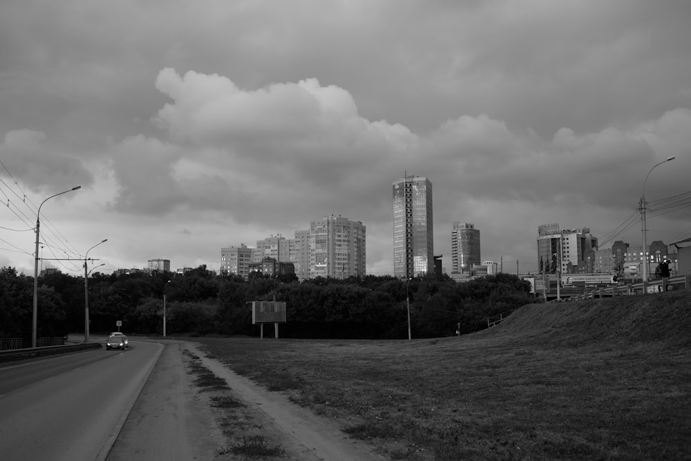 grayscale photo of city buildings