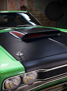 Close-up of a car hood being expertly painted in a workshop.