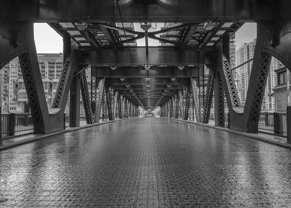 grayscale photo of bridge over water