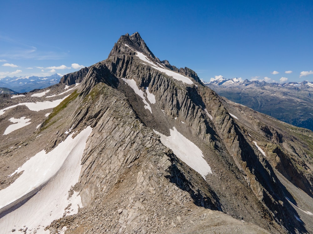 gray and green mountain under blue sky during daytime