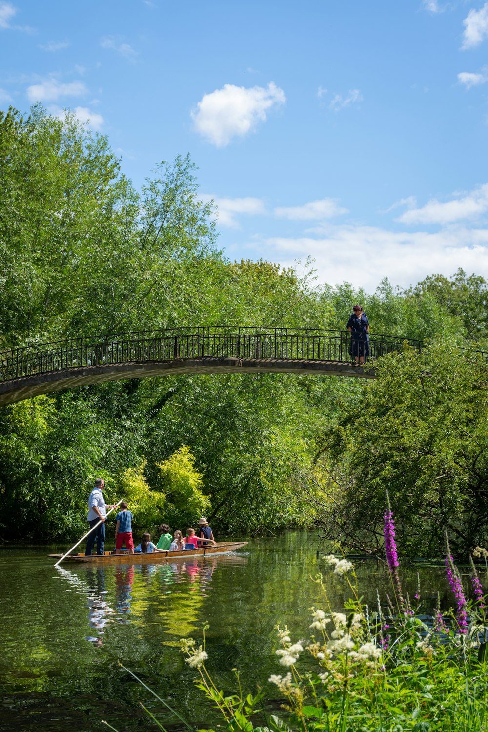 people riding on boat on river during daytime