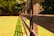 brown wooden fence on green grass field during daytime