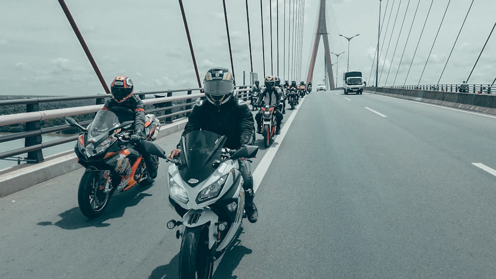 people riding on motorcycle during daytime