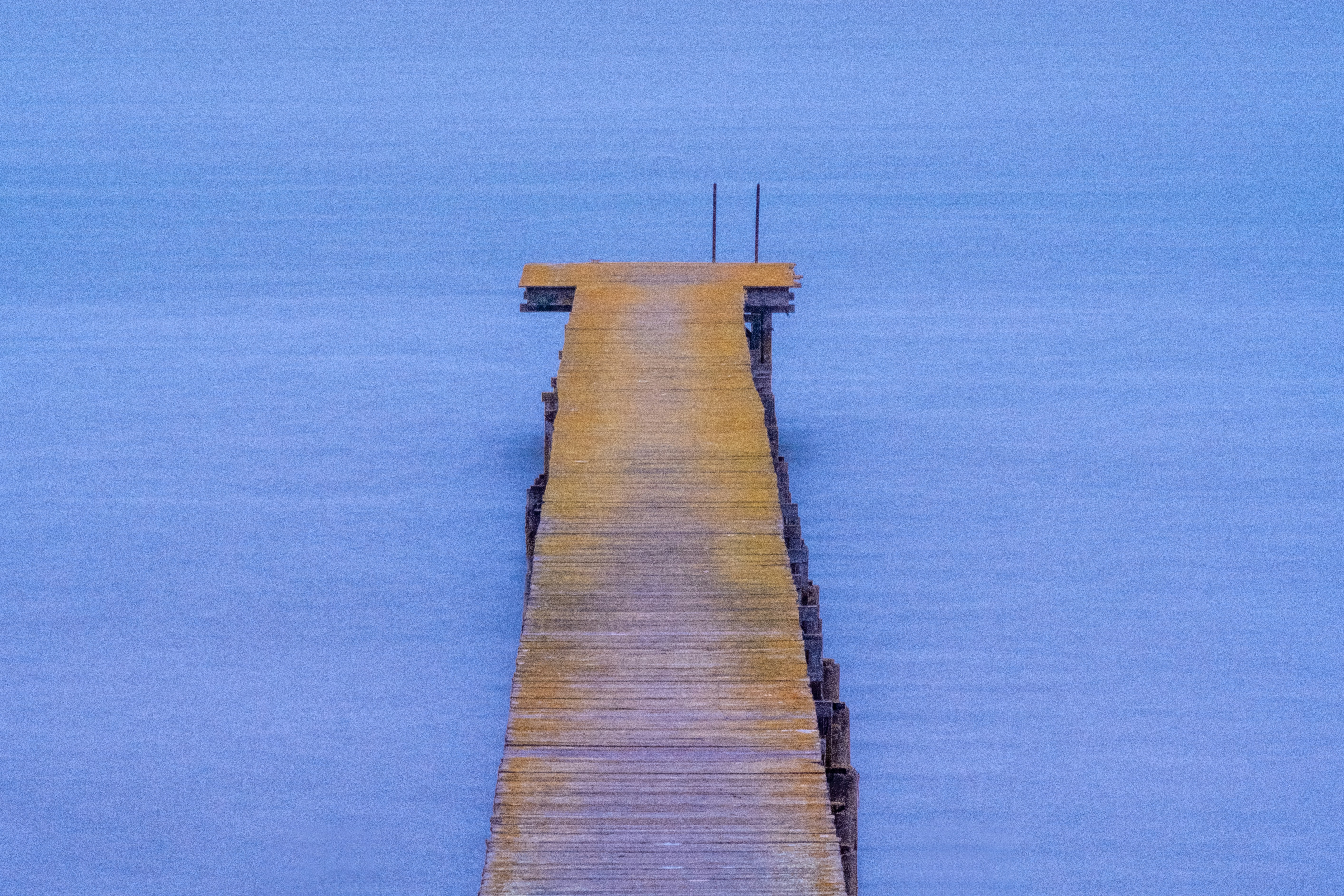 brown wooden dock on body of water during daytime, A quiet night on Tomales Bay from the Boatsman Quarters at Manka