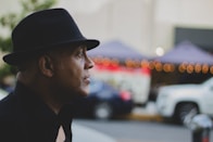 man in black hat and black shirt
