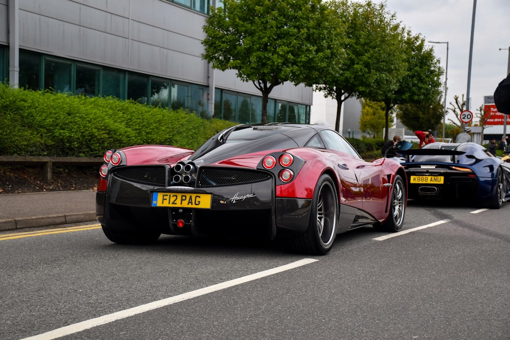 red ferrari 458 italia parked on road during daytime