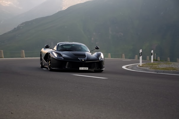 A powerful Ferrari speeding down a winding road.