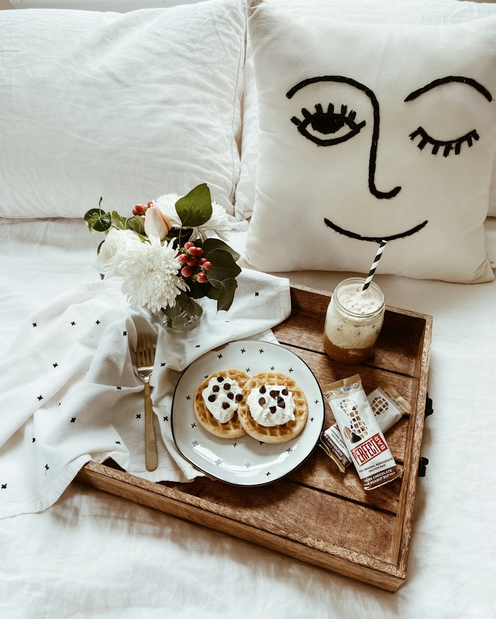 white ceramic plate with food on brown wooden tray