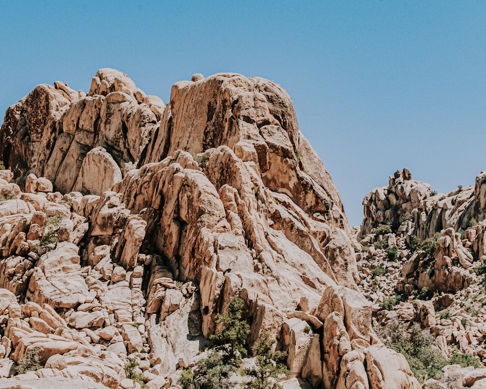 brown rock formation under blue sky during daytime