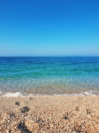 blue sea under blue sky during daytime