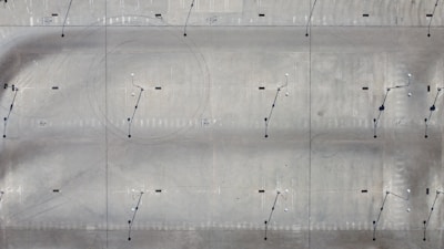 An aerial view of a large concrete driveway installation.