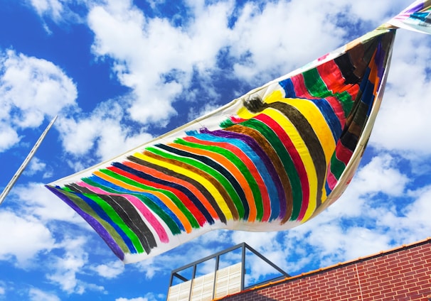 multi colored striped umbrella under blue sky during daytime