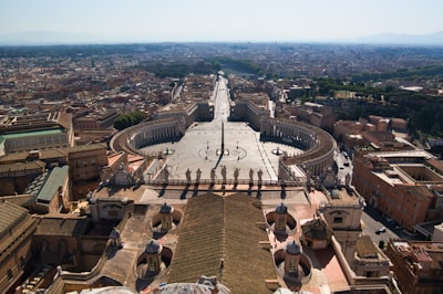 people walking on park during daytime vatican city teams background