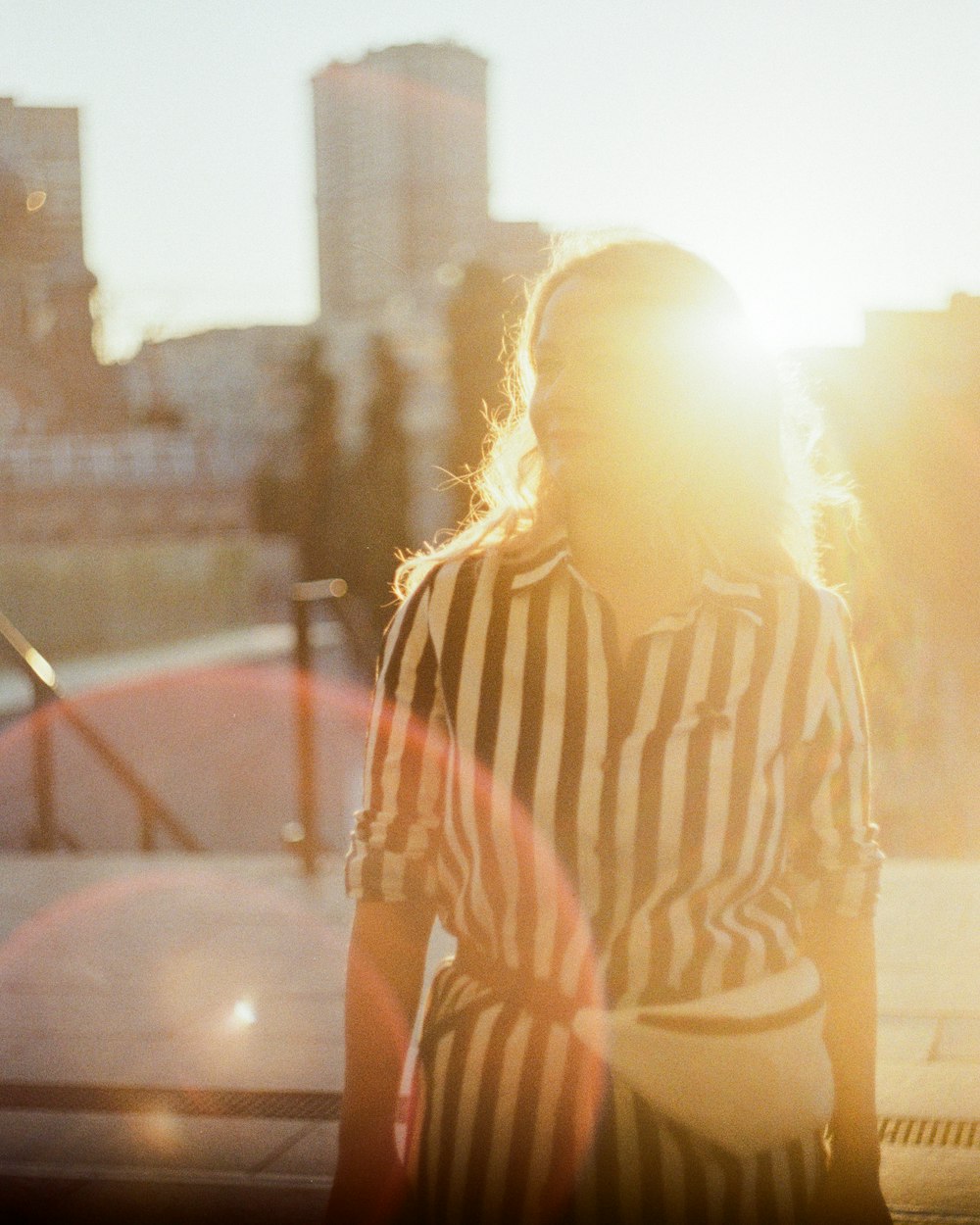 woman in white and black stripe shirt