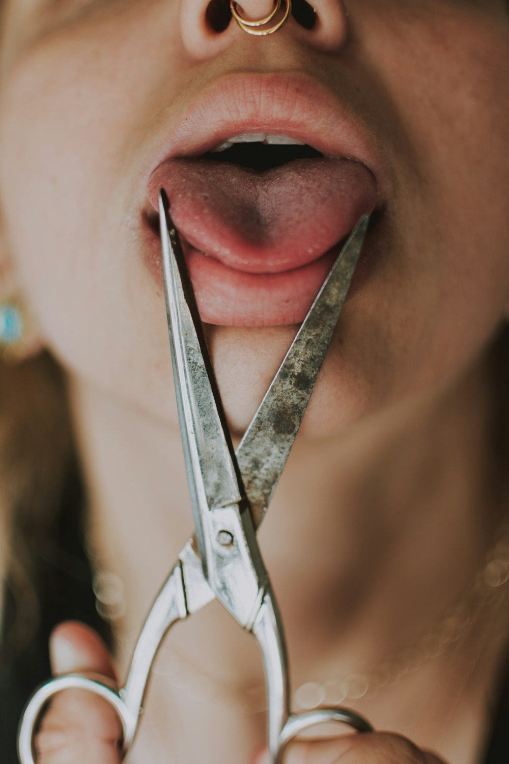 woman with silver nail cutter