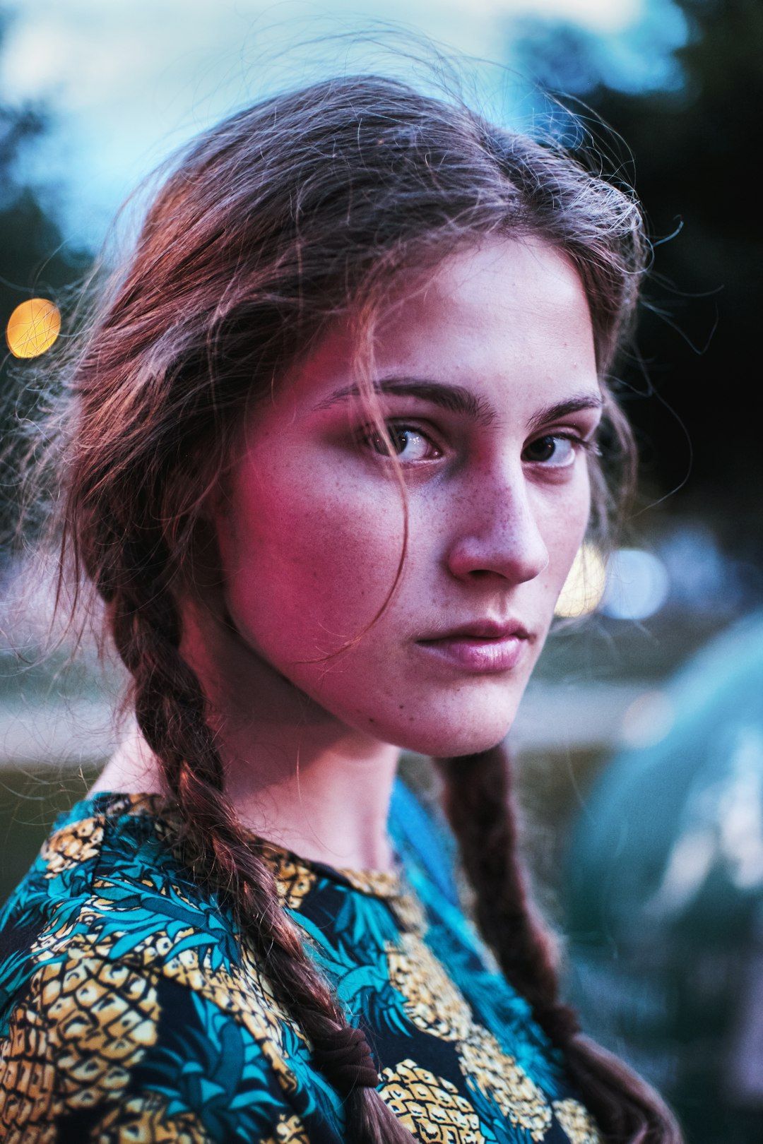 woman in blue green and yellow floral shirt