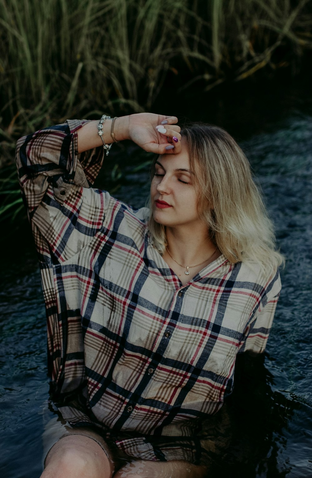 woman in black and white plaid long sleeve shirt