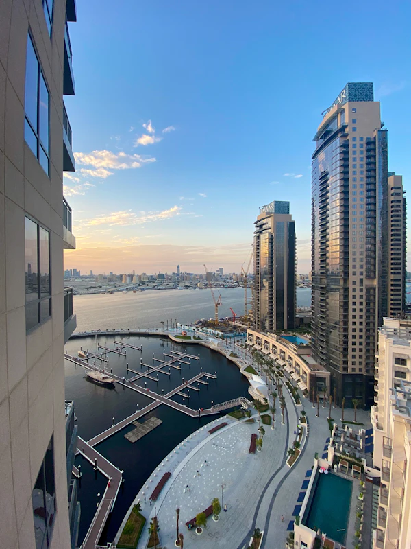 White buildings beside the water under a blue sky