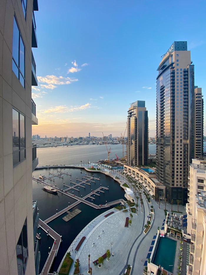White buildings beside the water under a blue sky