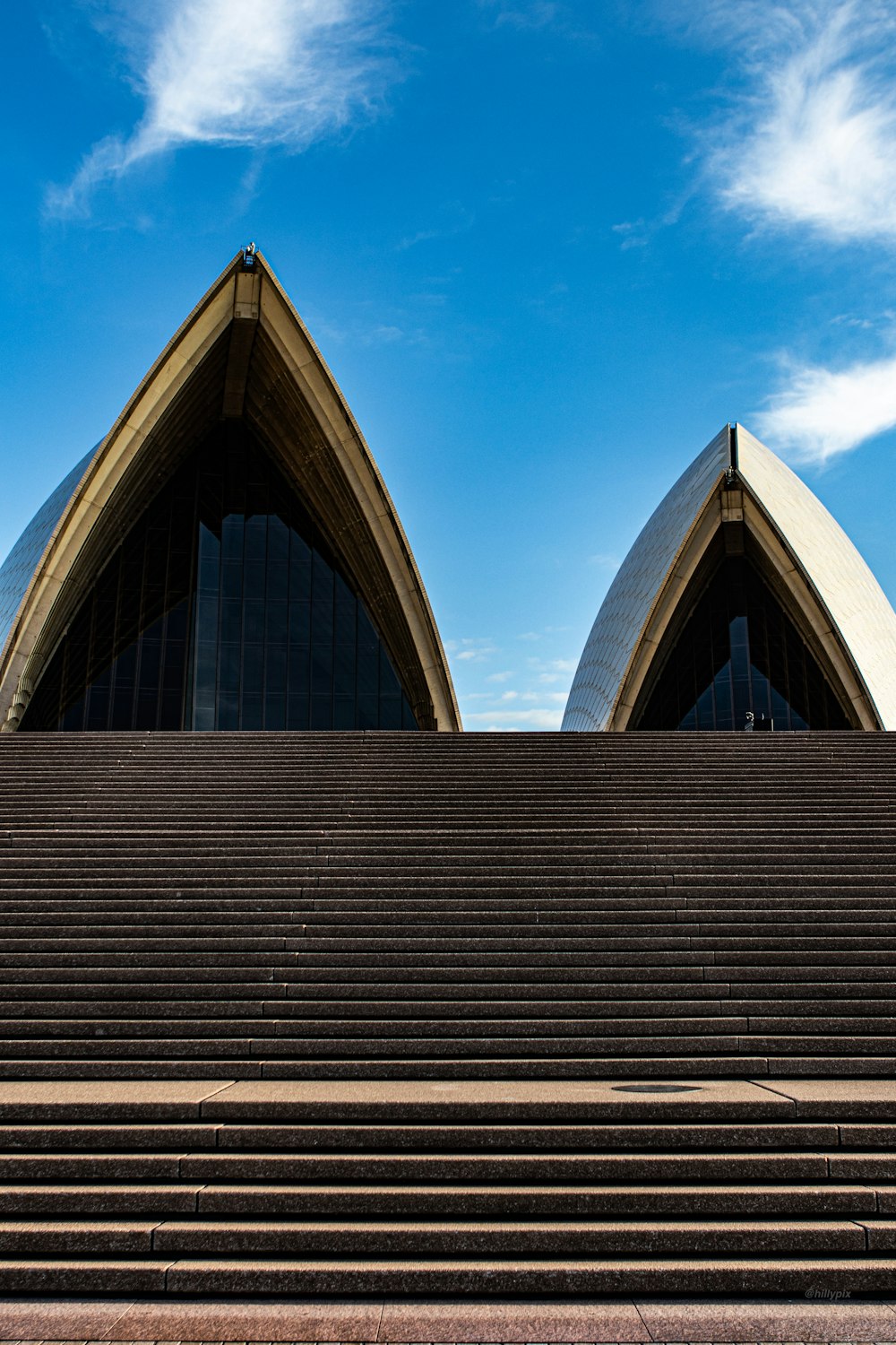 brown and white concrete building under blue sky during daytime