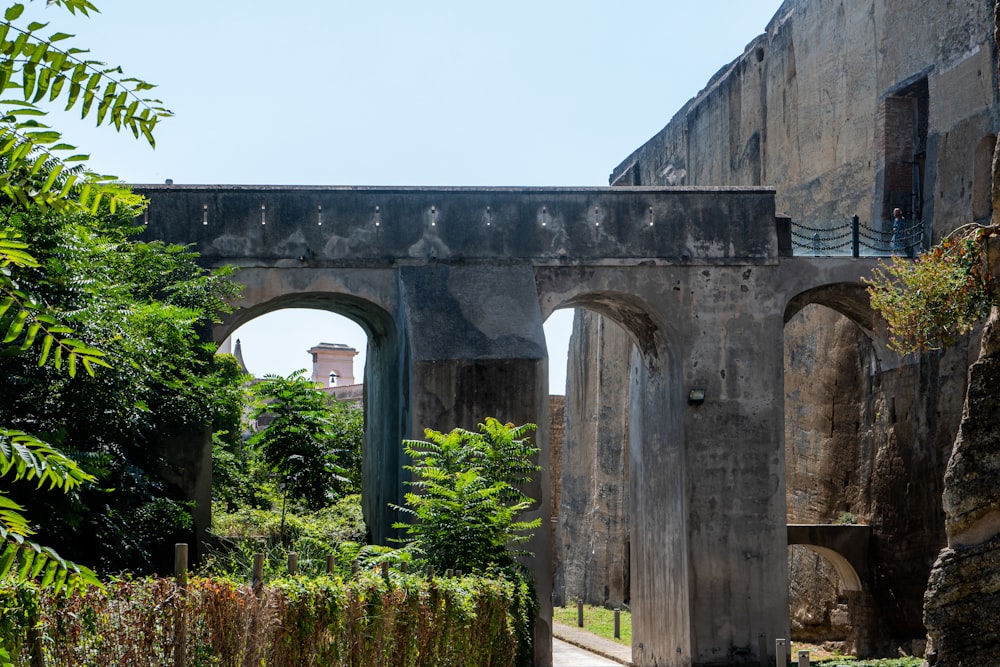 an old building with arches and a walkway