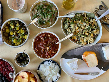 A colorful spread of fresh fruits, vegetables, and healthy dishes arranged on a table.